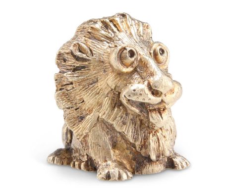 AN ELIZABETH II PARCEL-GILT LION PAPERWEIGHT by Stuart Devlin, London 1974. 3.5cm high, 3.7 troy ounces