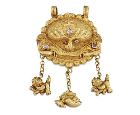 AN UNUSUAL AMULET BOX PENDANT as a dragon mask, inset with rose-cut diamonds and pink sapphires, suspending a fish and two li