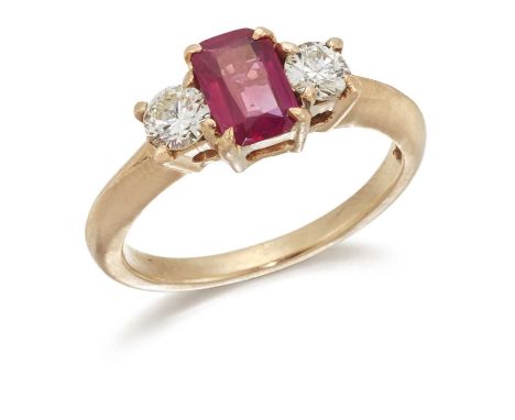 A RUBY AND DIAMOND THREE STONE RING an octagonal-cut ruby spaced by round brilliant-cut diamonds. Estimated total diamond wei