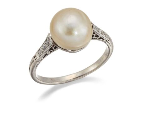 A NATURAL SALTWATER PEARL AND DIAMOND RING a button pearl to diamond-set shoulders and a reeded shank. Ring size L, 3.1 grams