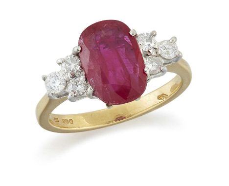 AN 18 CARAT GOLD RUBY AND DIAMOND RING an oval-cut ruby spaced by groups of round brilliant-cut diamonds. Estimated total dia
