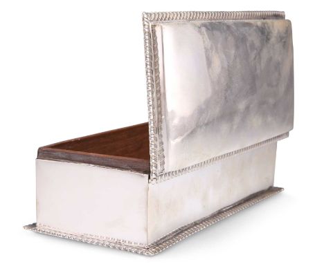AN EDWARDIAN SILVER CIGAR BOX by John Marshall Spink, London 1902, rectangular with hinged cover and gadrooned rims, wood-lin