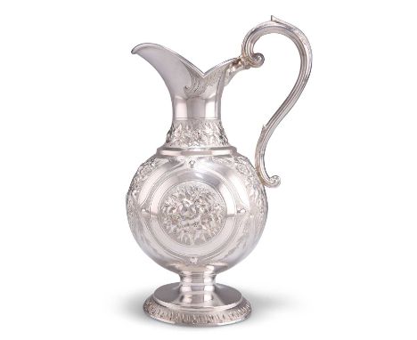 A VICTORIAN SCOTTISH SILVER CREAM EWER by William Marshall, Edinburgh 1865, with leaf-capped scroll-form handle, chased with 