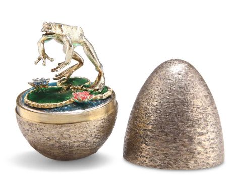 AN ELIZABETH II SILVER-GILT SURPRISE EGG by Stuart Devlin, London 1987, opening to reveal a frog standing on vivid green enam