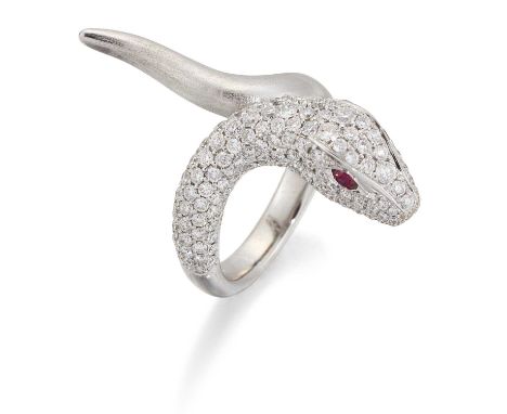 A RUBY AND DIAMOND SNAKE RING a coiled snake with a pavé-set diamond head and ruby-set eyes, to a brushed polished body. Stat