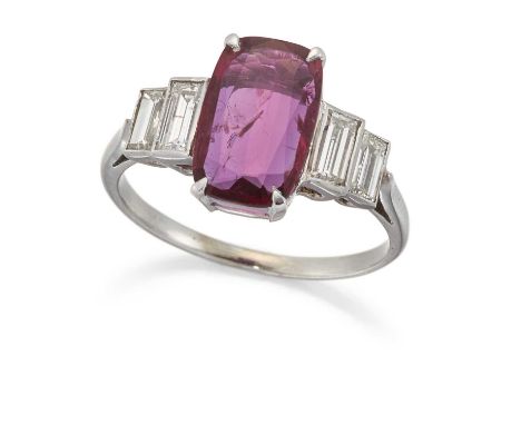 A RUBY AND DIAMOND RING a cushion-cut ruby in a claw setting, spaced by pairs of baguette-cut diamonds. Estimated total diamo