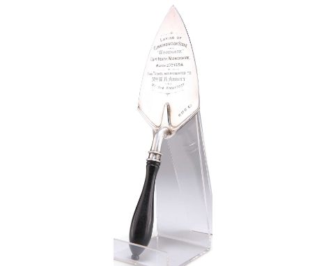 A GEORGE V SILVER PRESENTATION TROWEL by Albert Edward Jones, Birmingham 1933, of plain typical form, with turned wooden hand