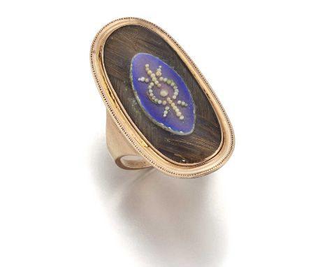 AN ENAMEL AND HAIRWORK MOURNING RING the navette head with a central blue enamel panel decorated with seed pearls, above plai