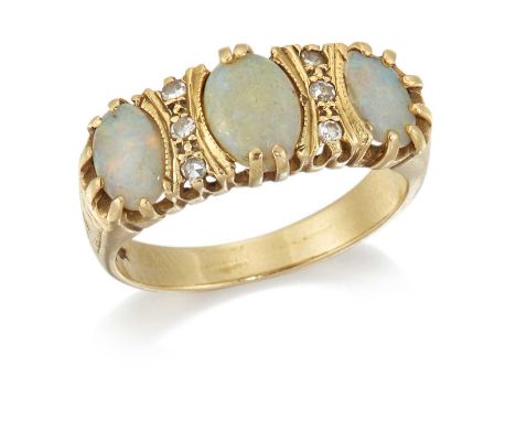 AN OPAL AND DIAMOND RING three graduated oval opals spaced by eight-cut diamonds, to foliate engraved shoulders. Marked '18CT