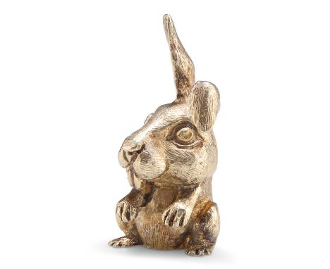 AN ELIZABETH II PARCEL-GILT RABBIT PAPERWEIGHT by Stuart Devlin, London 1973. 5cm high, 2.1 troy ounces