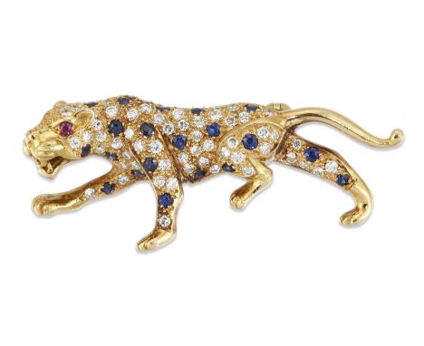 AN 18 CARAT GOLD SAPPHIRE AND DIAMOND LEOPARD BROOCH modelled in a walking pose, pavé-set throughout with round-cut sapphires