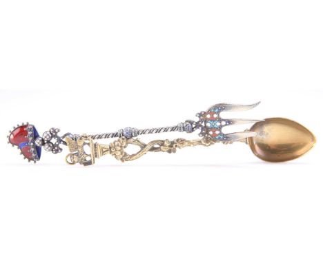 A CONTINENTAL SILVER AND ENAMEL PICKLE FORK, AND A SILVER-GILT SPOON AN 800 GRADE SILVER AND ENAMEL PICKLE FORK; together wit