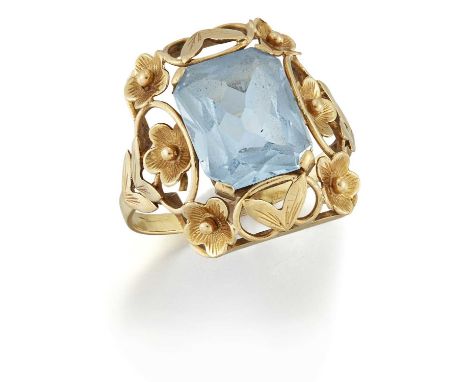 A BLUE SPINEL RING an octagonal-cut blue spinel within a pierced floral frame. Ring size P1/2, 4.7 gramsStone a little loose 