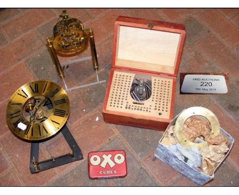 A clock for restoration, together with a set of cased tools 