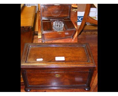 An antique rosewood tea caddy with fitted interior 