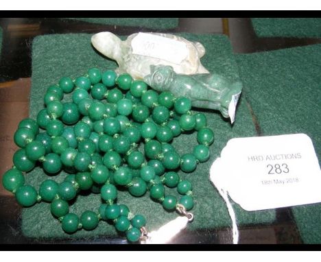 A jade bead necklace, together with tortoise and cat 