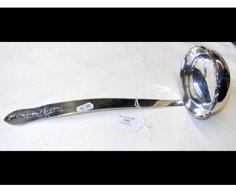 An American sterling silver ladle with applied decoration on handle 