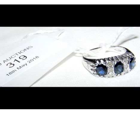 An 18ct white gold sapphire and diamond ring 