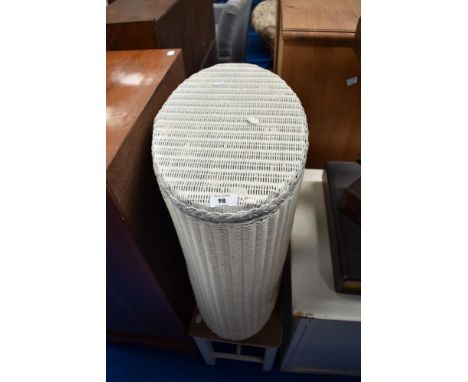 A Lloyd loom linen basket , bathroom cabinet and stool