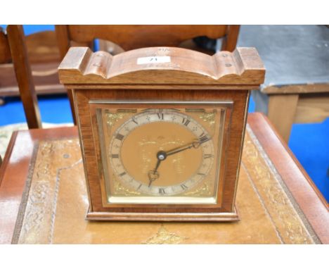 A vintage mahogany cased mantel clock having brass dial named for Elliott