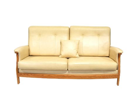 Ercol, three seat leather sofa, open beech wood frame with two button upholstered back pads and two seat pads, upholstered wr