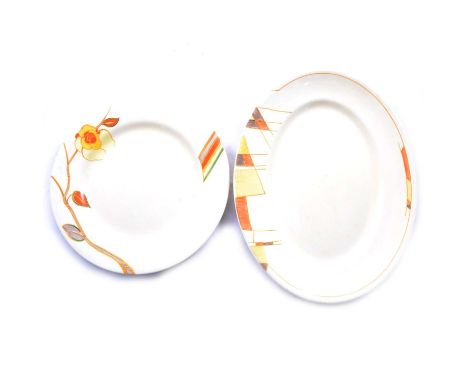 Clarice Cliff, a 10" dinner plate painted with a yellow flower on branch, Bizarre backstamp, 25.2cm diameter, and an oval pla