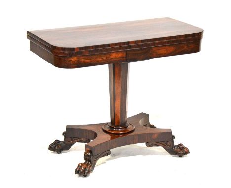 William IV rosewood card table, d-shaped top raised on an octagonal column, on shaped base, further raised on lion paw feet a