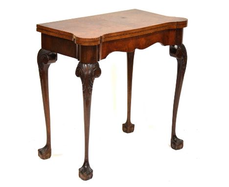 Georgian style walnut card table, serpentine foldover top with baize lined interior, carved cabriole legs with ball and claw 