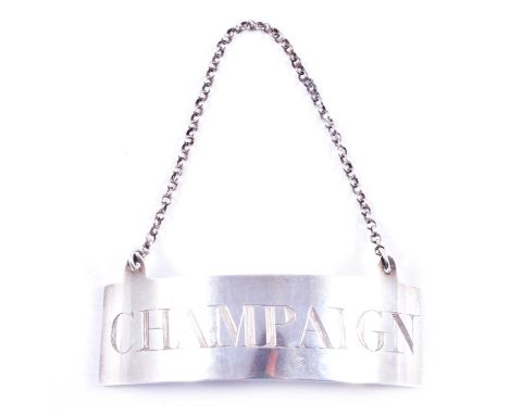 A George III Scottish silver Champaign label, George Fenwick, Edinburgh 1806, plain polished rectangular curved form, with ch