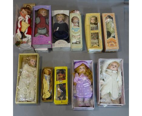a collection of 12 ceramic dolls, in their original boxes, mostly from Leonardo Collection 