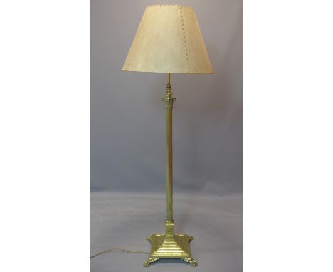A Victorian Neo Classical brass telescopic Corinthian column floor standing lamp, on stepped base with lion paw feet, with ve