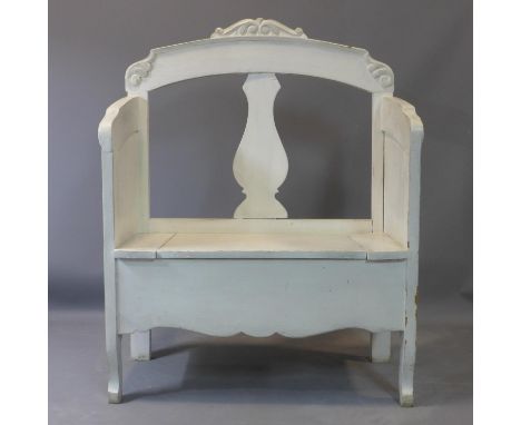 A vintage distressed painted pine settle, possibly French, with carvings to arms, on cabriole legs, H.116 W.89 D.40cm 