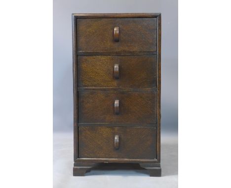 An Art Deco oak side chest of four drawers, on bracket feet, H.75 W.40 D.38cm 