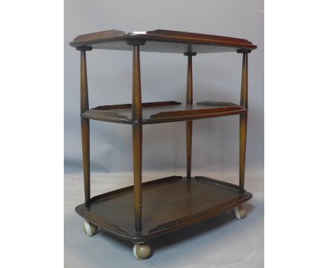 A mid 20th century Ercol three tier trolley, raised on castors, H.78 W.72 D.47cm 