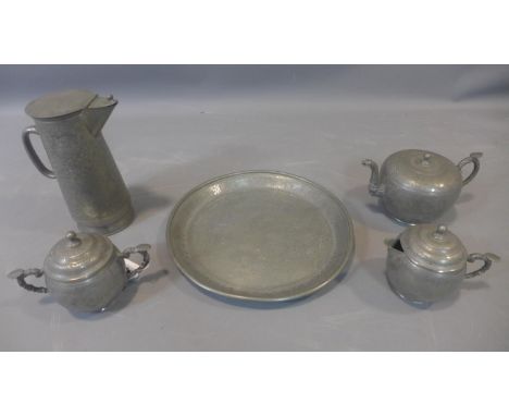 A Chinese pewter tea set, to include a teapot, hot water pot, jug, twin handled sugar pot and tray, decorated with dragons an