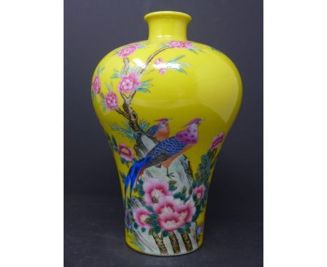 A 20th century Chinese famille rose vase, decorated with birds and blossoming flowers on a yellow ground, bearing seal mark t