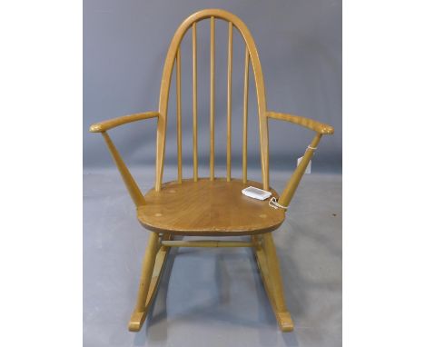 An Ercol beech and elm rocking chair, marked BS 1960 to base, H.84cm 