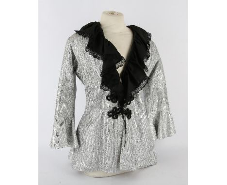 An Original Stage Costume as worn by Christine Glanville, c. 1950s-60s.- a silver fabric tunic, lined, with bell sleeves and 