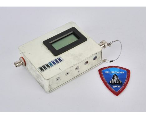 Europa Report (2013) Prop White living module thermometer box and a Mini Europa One shield patch (2). With Propstore COAs. 