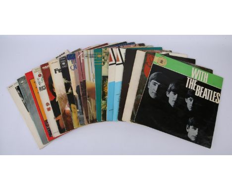 18 Lps including The Beatles, The Rolling Stones, Wings, Simon & Garfunkel and more. Condition Report:  Condition average VG