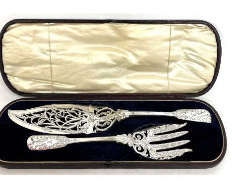 Pair of Victorian fiddle pattern silver plated fish servers, the pierced slice engraved with a fish design, both presented in