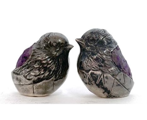 Two small Sampson Mordan &amp; Co silver 'chick' pin cushions in the form of a chick emerging from an egg (loaded), hallmarke