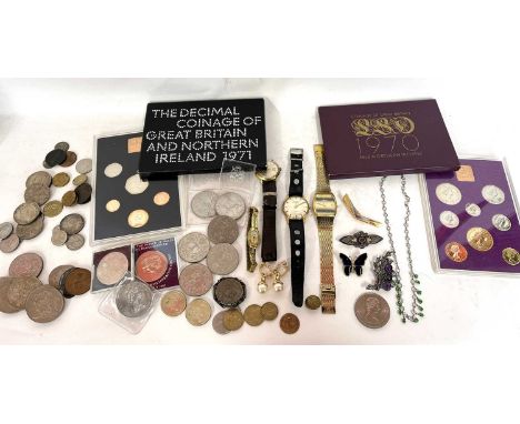A mixed lot of wristwatches along with some coinage, makers of the watches include Timex, Montire and Sekonda (all a/f)