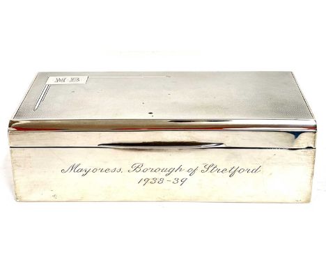 George VI silver cigarette box of rectangular form, the hinged lid with engine turned decoration and engraved initials 'M.B',