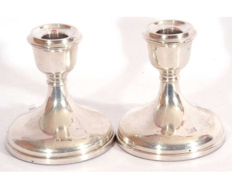 Pair of hallmarked silver small candle sticks of squat form with weighted bases, hallmarked Birmingham 1972, makers mark is C