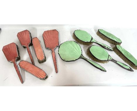 Art Deco five piece metal and green guilloche and enamel dressing table wares to include a mirror, two hairbrushes and two cl