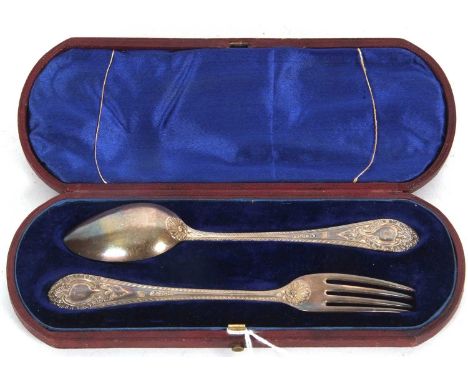 Cased pair of Victorian christening fork and spoon with feather edged and cartouche embossed handles, 15cm long, London 1869 