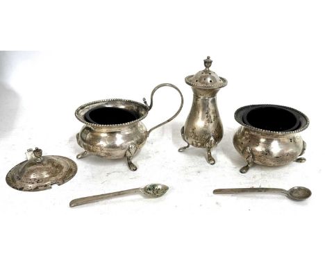 Cased condiment set comprising lidded mustard (a/f) pepper, open salt and two condiment spoons, each stamped sterling silver