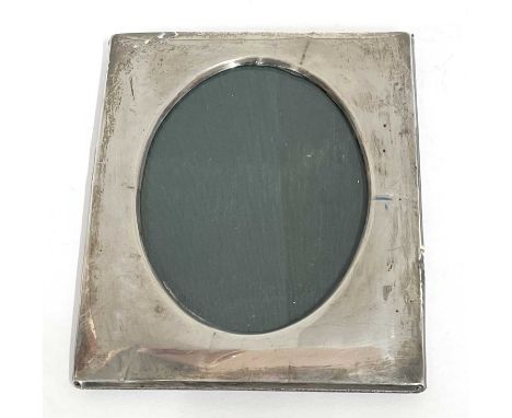 George V silver photograph frame of plain polished rectangular form having an easel back and hallmarked Birmingham 1912, make