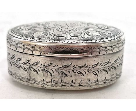 Edwardian silver snuff box of oval form, the hinged lid chased and engraved all over with scrolls and leaves having a monogra